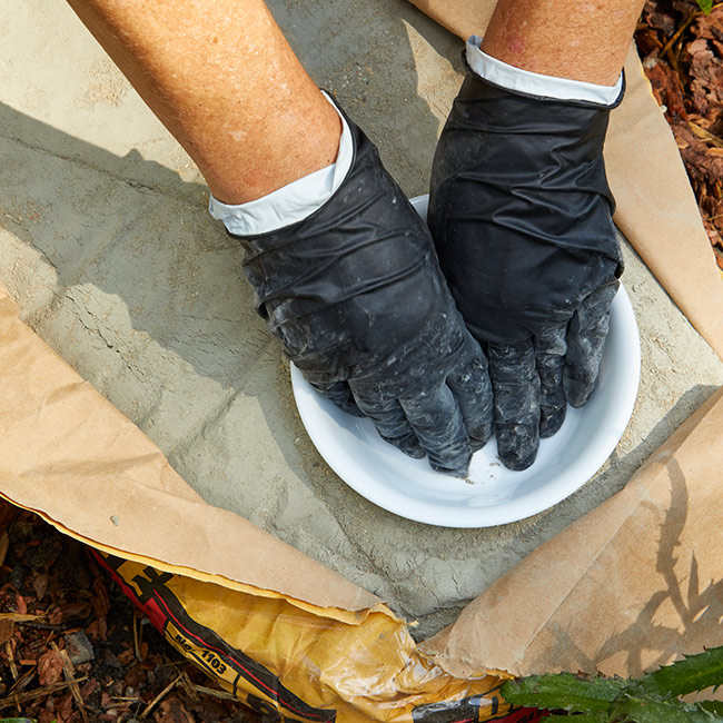 diy-butterfly-puddler-bowl-press: Wearing latex gloves will protect your hands from becoming dry if you contact the concrete mix. 