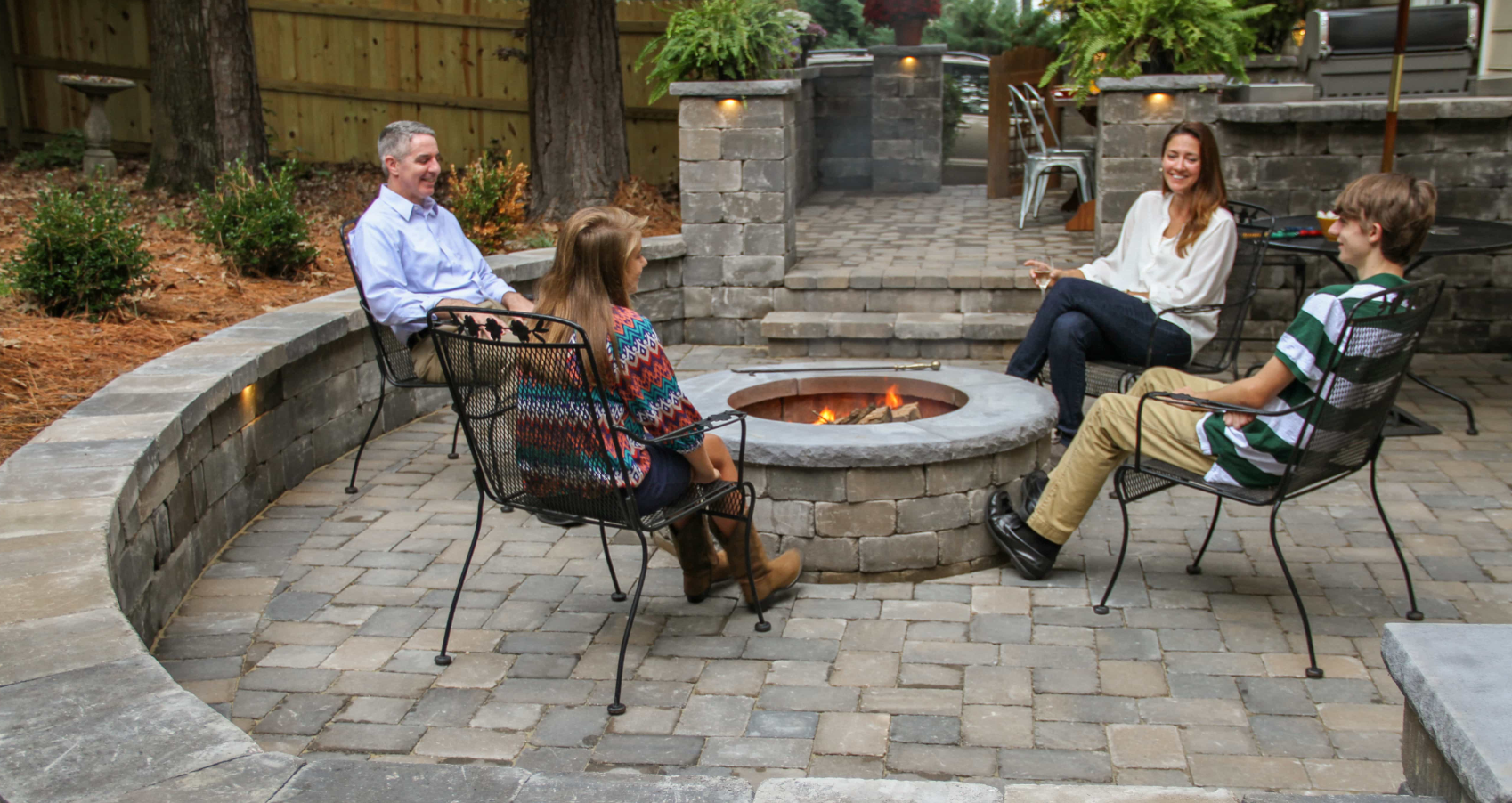 Newline Hardscapes -- Small Modern Garden Ideas With Guests: Ashland™ Fire Pit with retaining wall by Newline Hardscapes.