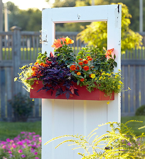 upcycled-door-planter-lead: This upcycled door turned planter adds rustic charm to your garden.