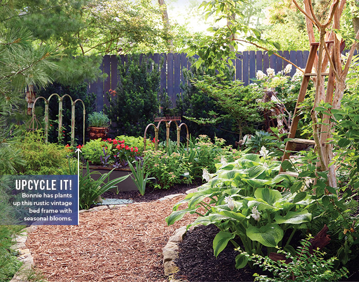Bonnie Duma upcycled bed frame garden bed and pathway:Look closely and you'll notice an upcycled metal bed frame turned into a unique raised bed!