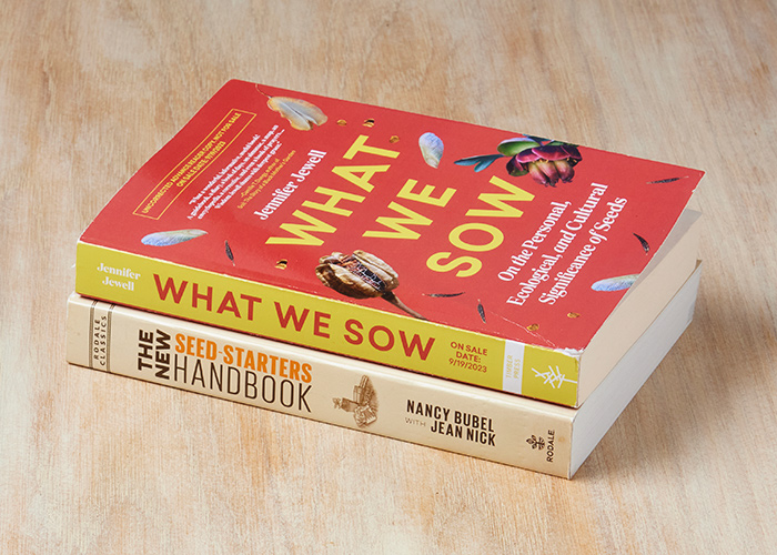Seed starting books in a stack: Enjoy these new and time-honored 
books about seeds.