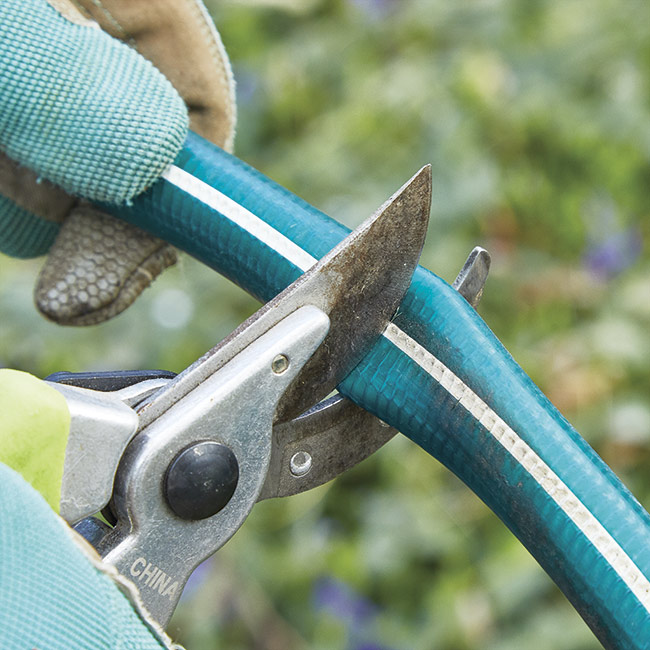 cutting garden hose with pruners: Pruners work well for cutting garden hose.
