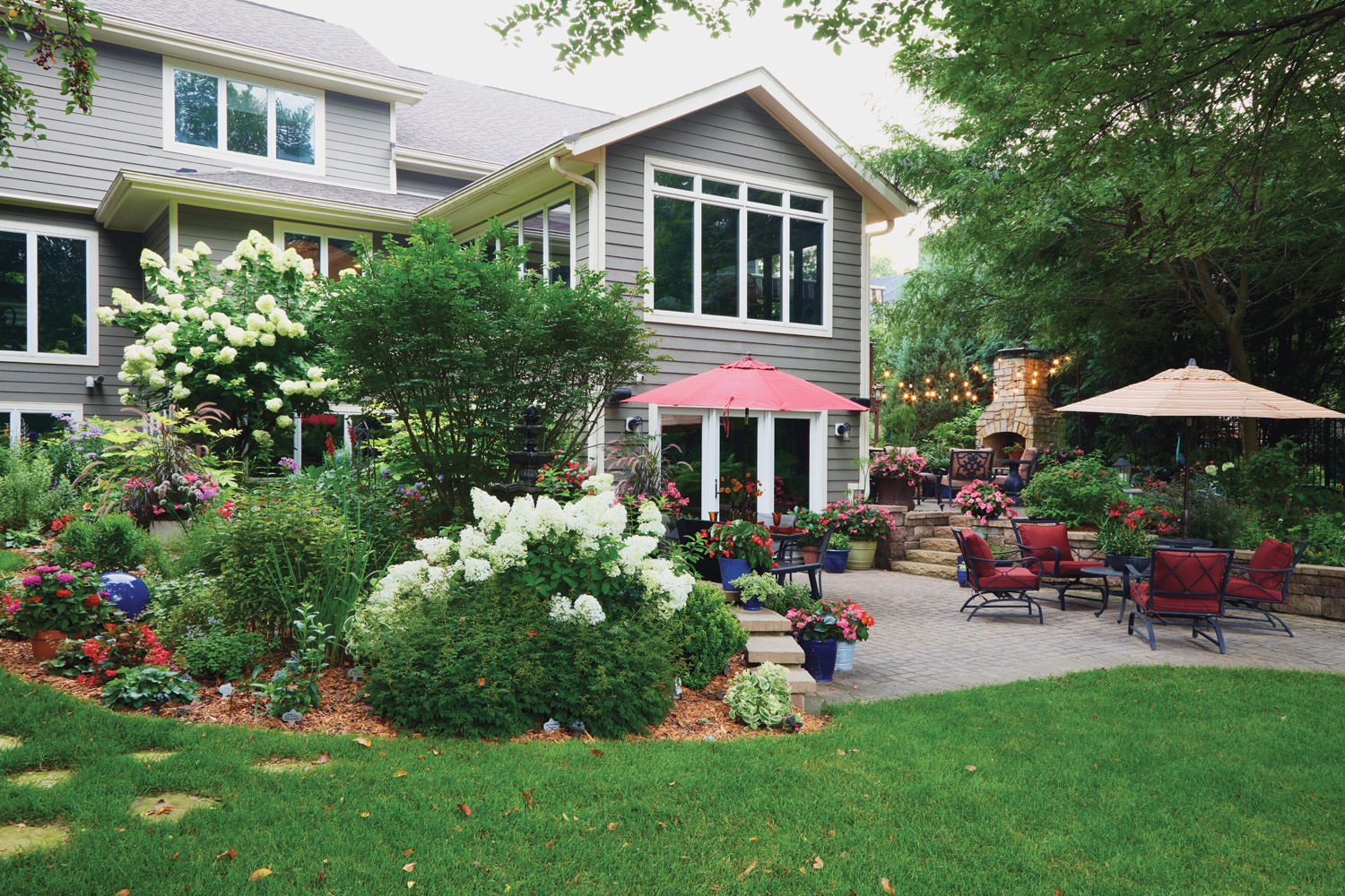 RGA Olson's back patio: Generous proportions — at 18×23 feet, this patio comfortably seats eight at two tables while still leaving room for colorful containers.