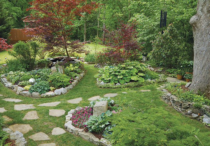 Southern Shade Garden beds: Flagstone pavers laid out on natural foot traffic patterns provide steady footing help visitors know where to walk. 