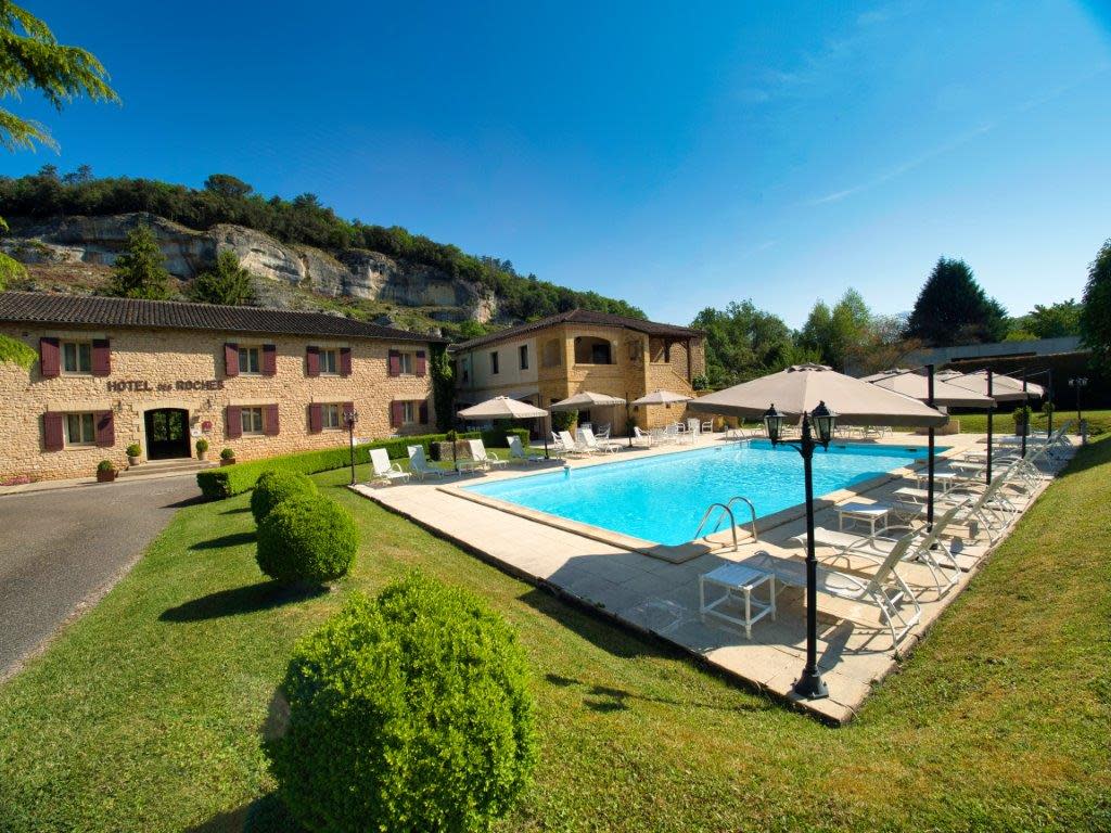 A hotel with an outdoor swimming pool
