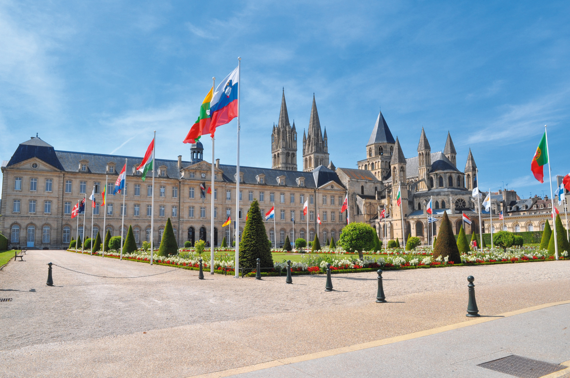 Abbaye aux Hommes in Caen with flags outside © Shutterstock
