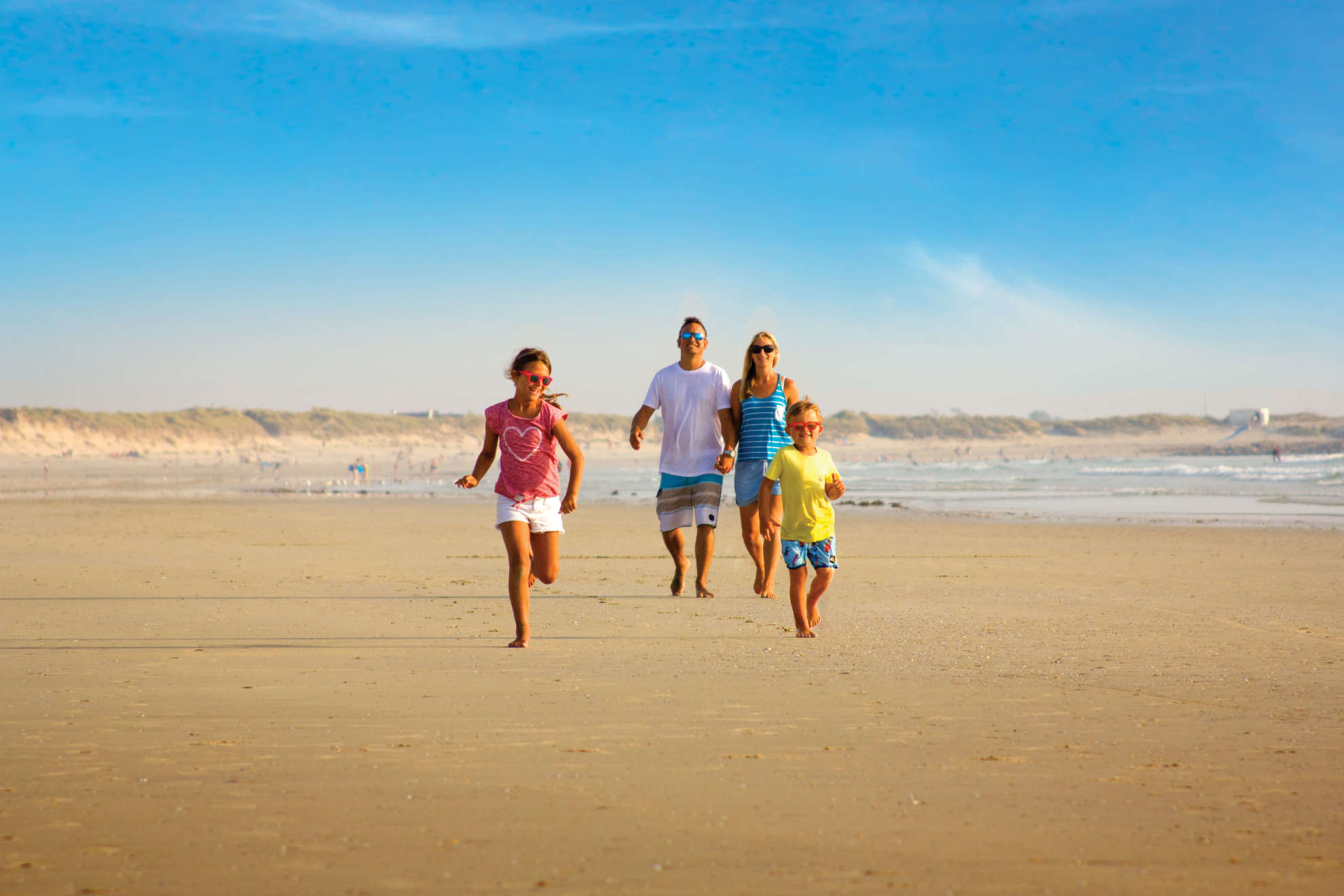 Family walking on the beach