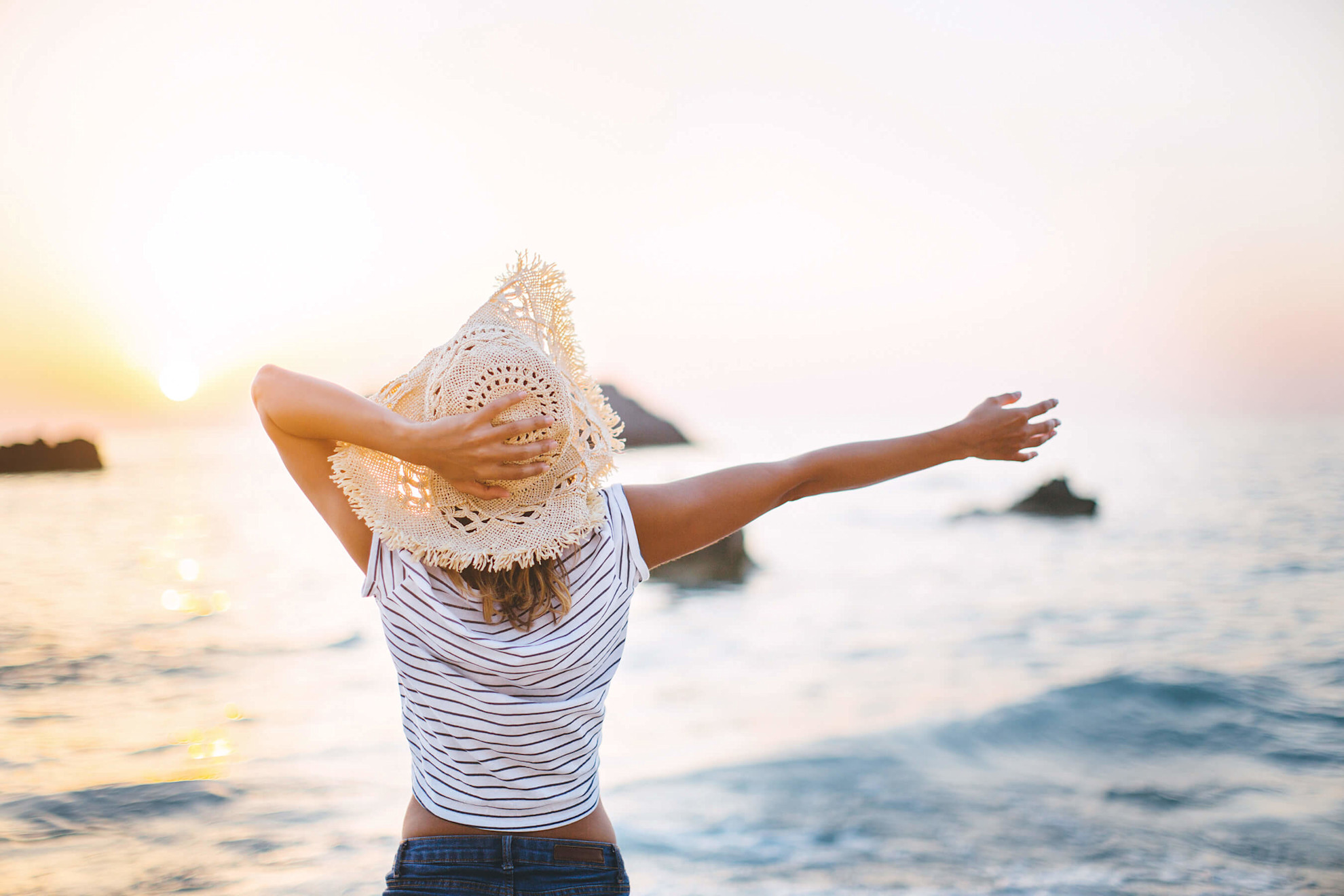 Woman enjoying a summer day on the beach 
