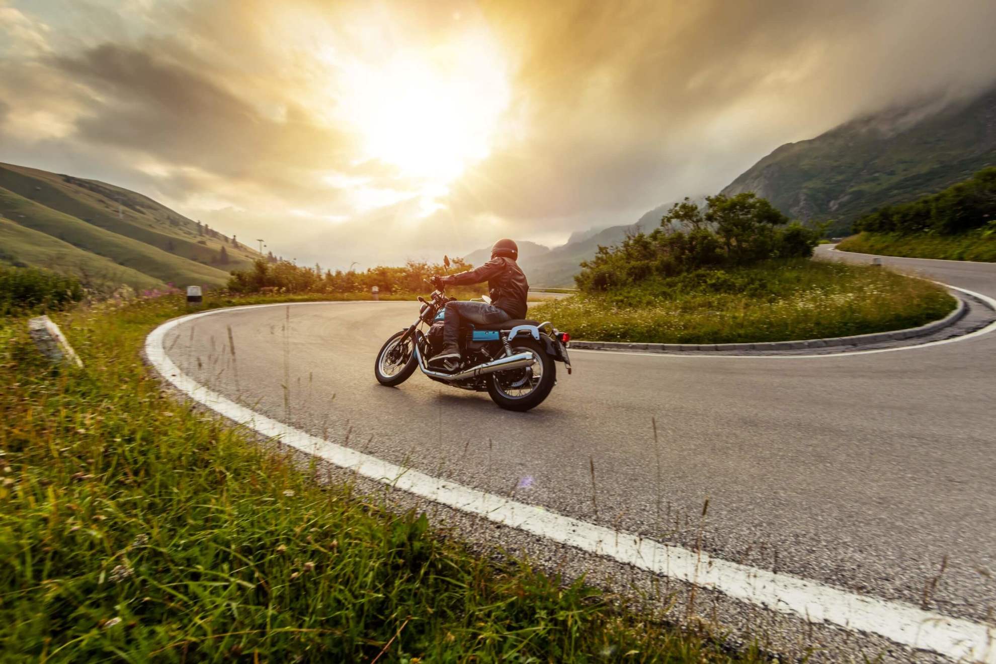 Motorbike on mountain road bend