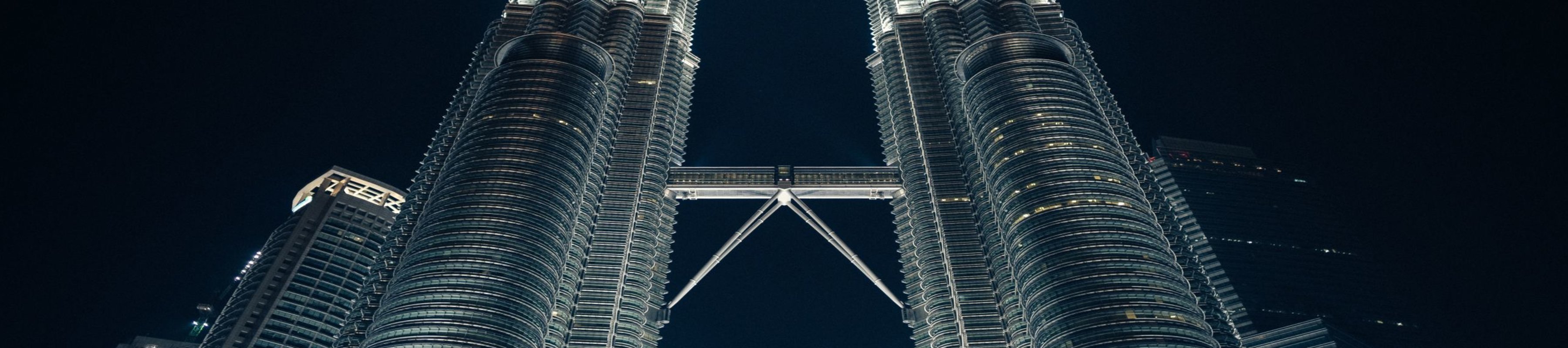 Image of twin building towers at an oblique angle