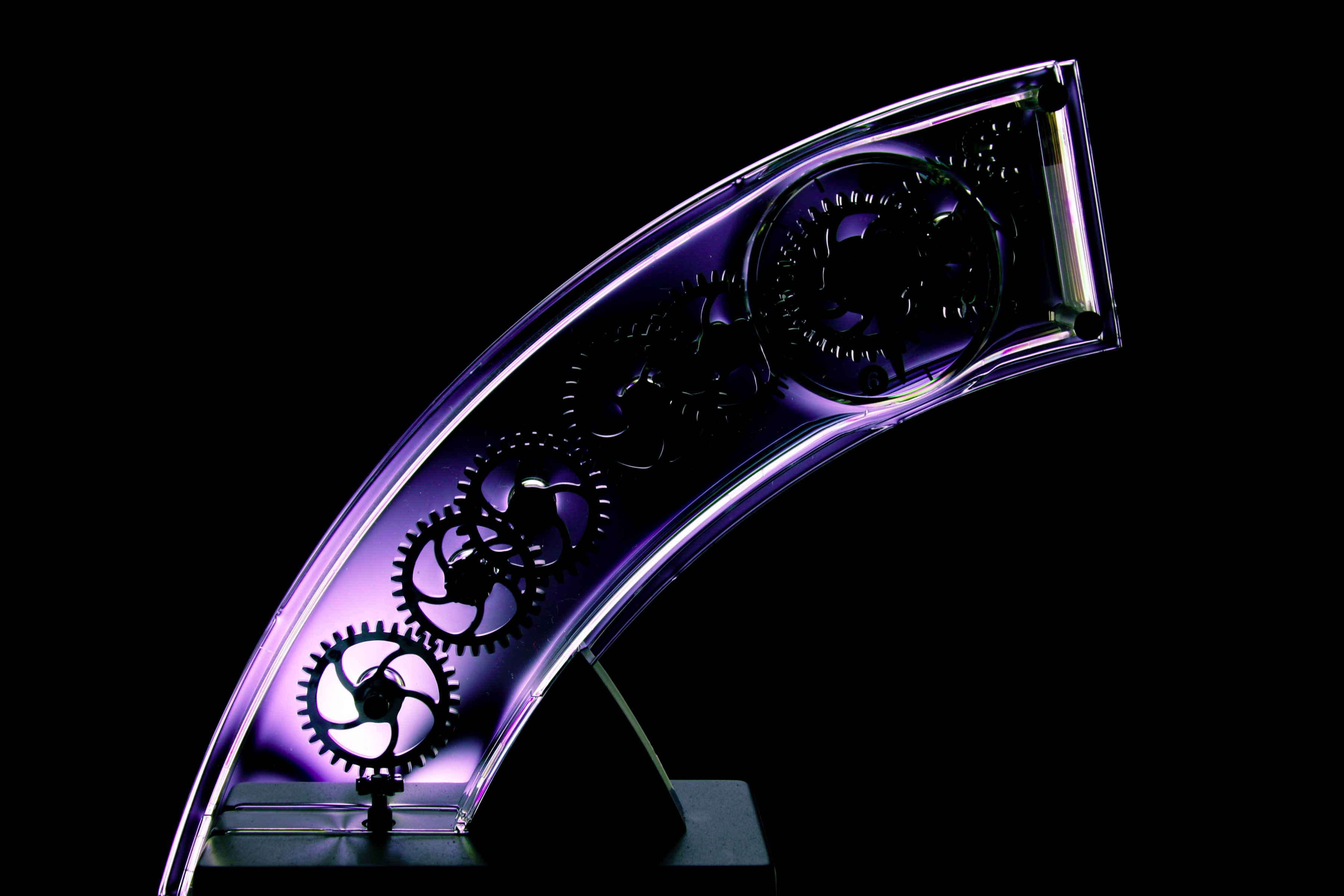 Partial purple arch with gears inside on black background