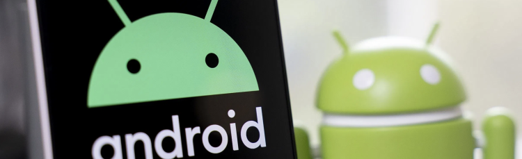 Android logo on sign beside android toy