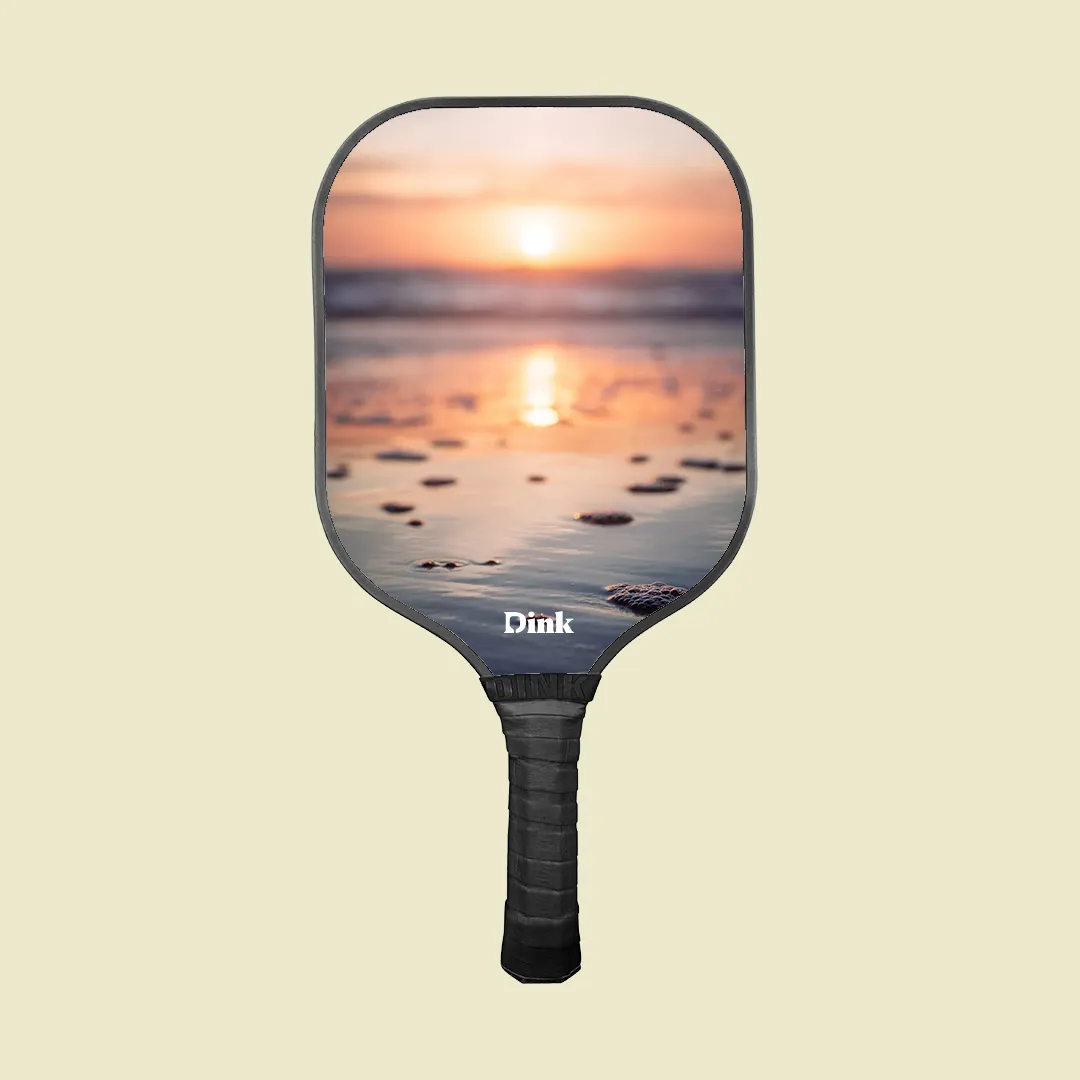 sunset on the beach image on the custom pickleball paddle from Dink