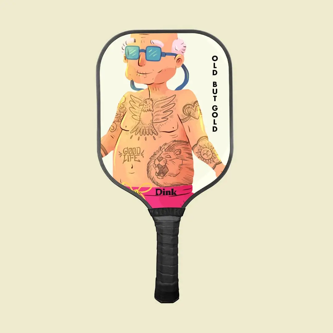 a paddle with a senior pickleball player with tatoos