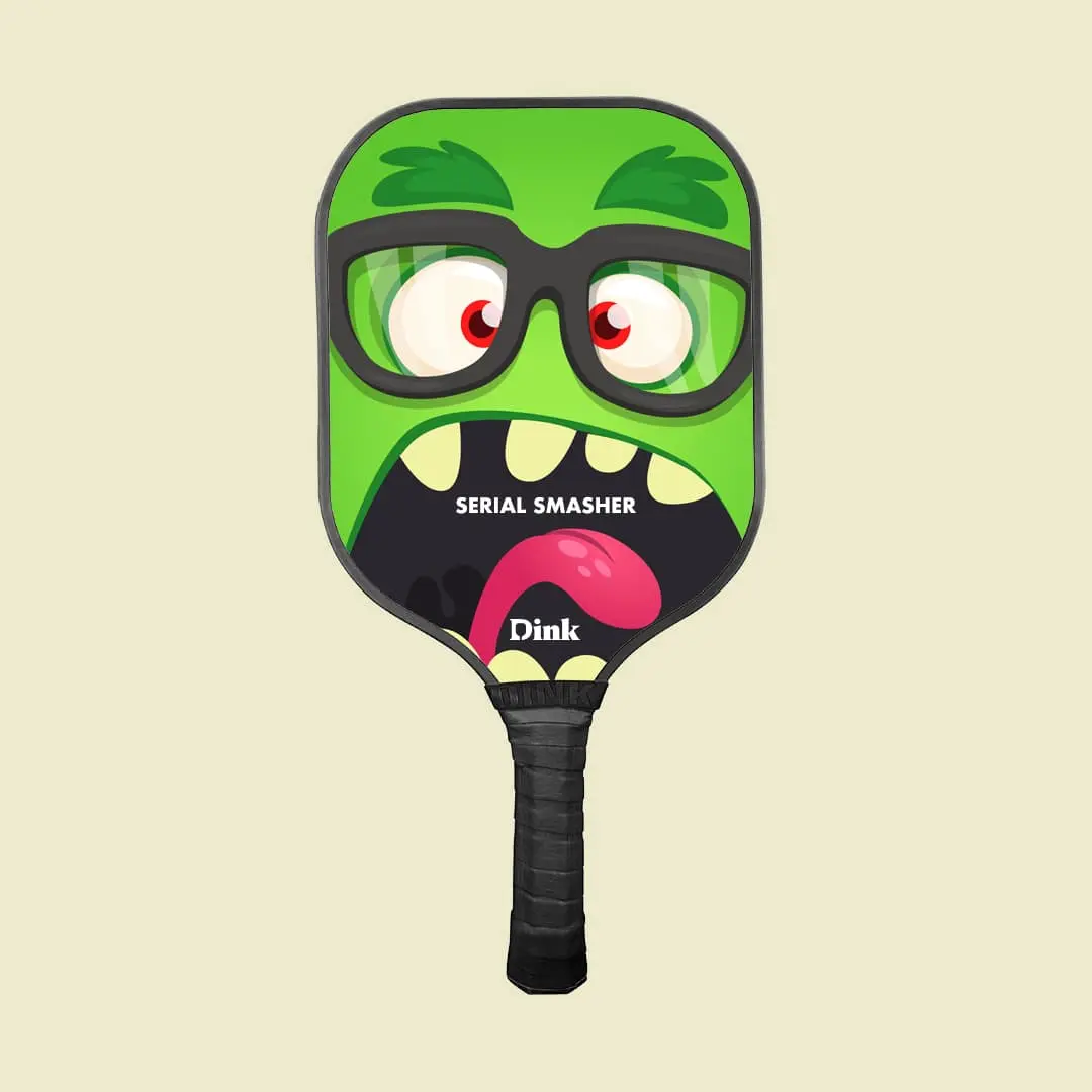 a pickleball paddle with an angry face 