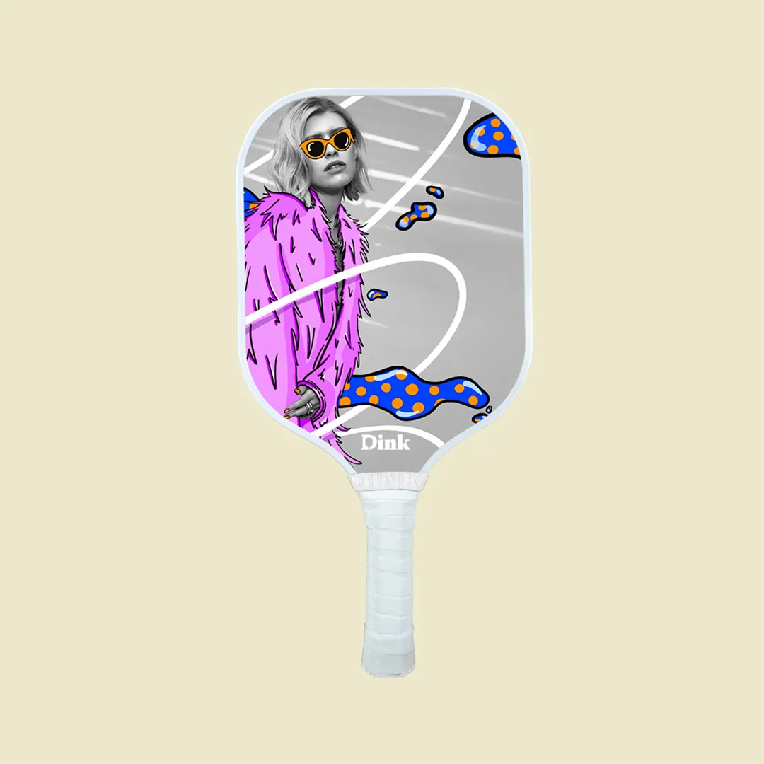 A custom pickleball paddle from Dink with an image of a celebrity and pop culture stickers