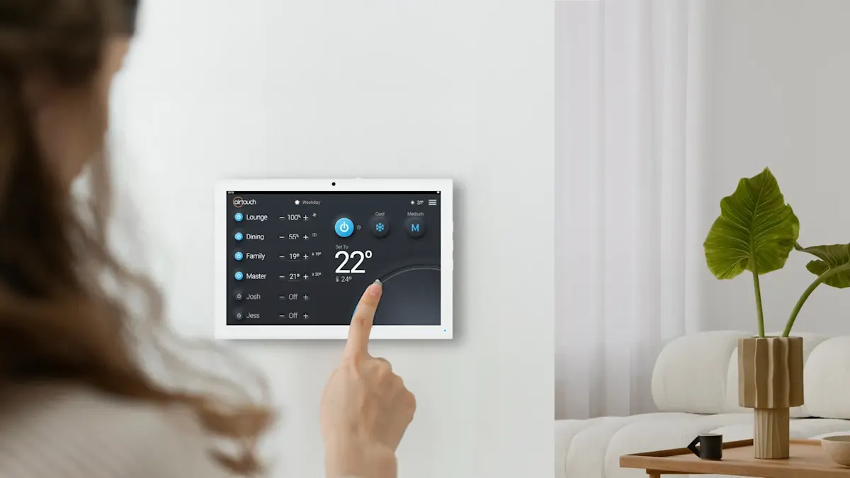 AirTouch 5 wall-mounted touchscreen controller in a living room