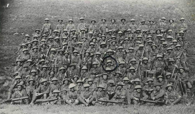 A group photograph of soldiers in uniform. A group photograph of soldiers in uniform.