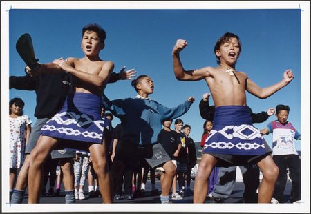 A group of boys performing in a kapa haka group.