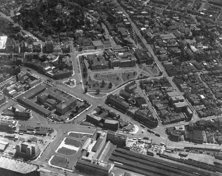 Black and white aerial photo of a city.