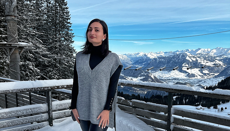 Diana in the snow with mountain background