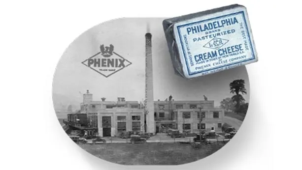 Picture from 1903 of Phenix cheese factory with a Philadelphia cream cheese pack in the foreground also from that time.