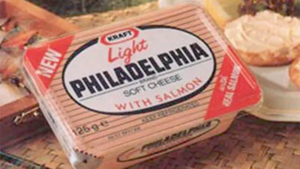 Philadelphia soft cheese with salmon package from 1980. Plate with toast and spread cheese in background.