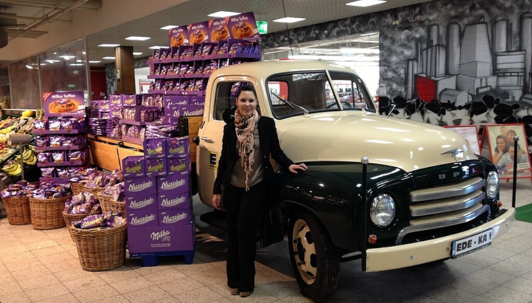 Nicole in front of a truck with Milka