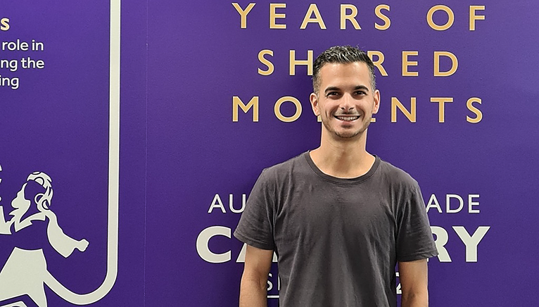 Adam in front of Cadbury sign