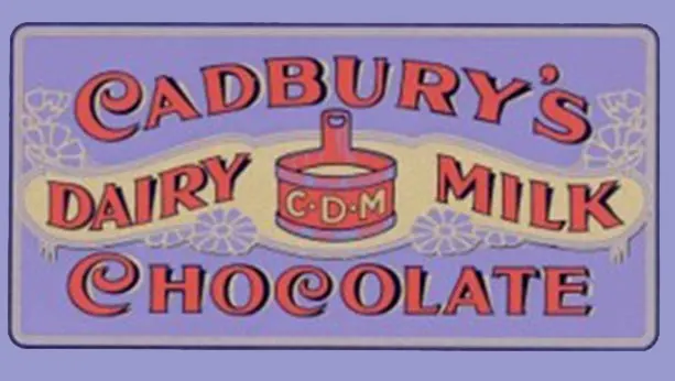 Vintage label from 1905 of written script that says "Cadbury's dairy milk chocolate" 