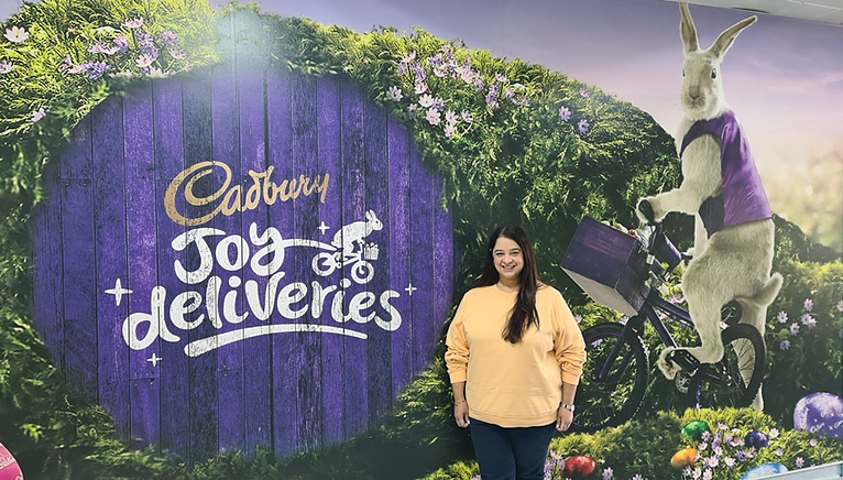 Shivani Saini in front of a Cadbury sign