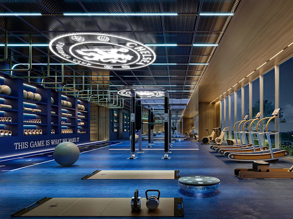 Chelsea branded entrance lobby with blue LED facade and luxury car
