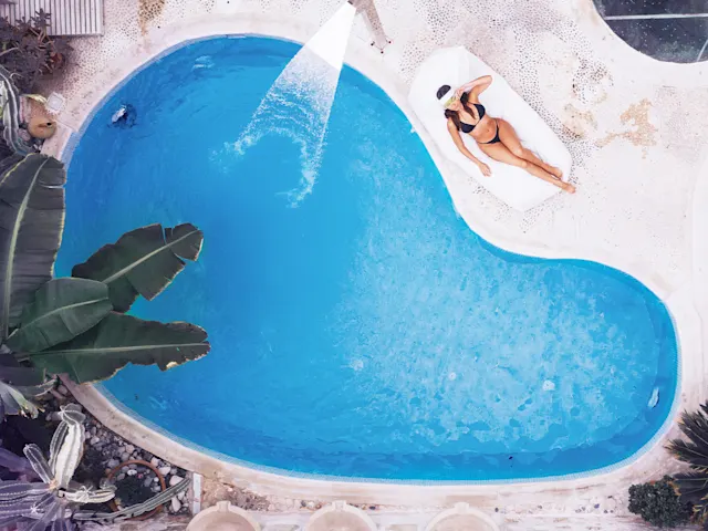Serene streams and an organic pool create a sanctuary for peaceful swims and laid-back lounging.