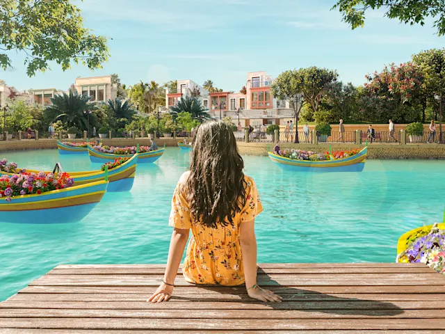 Explore vibrant boats adorned with exotic flowers, where you can scan QR codes to learn about different species or surprise a loved one with a fragrant bouquet.