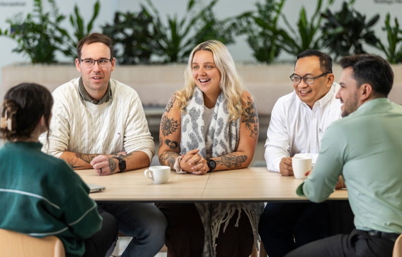 Group of 5 nib employees at the office 