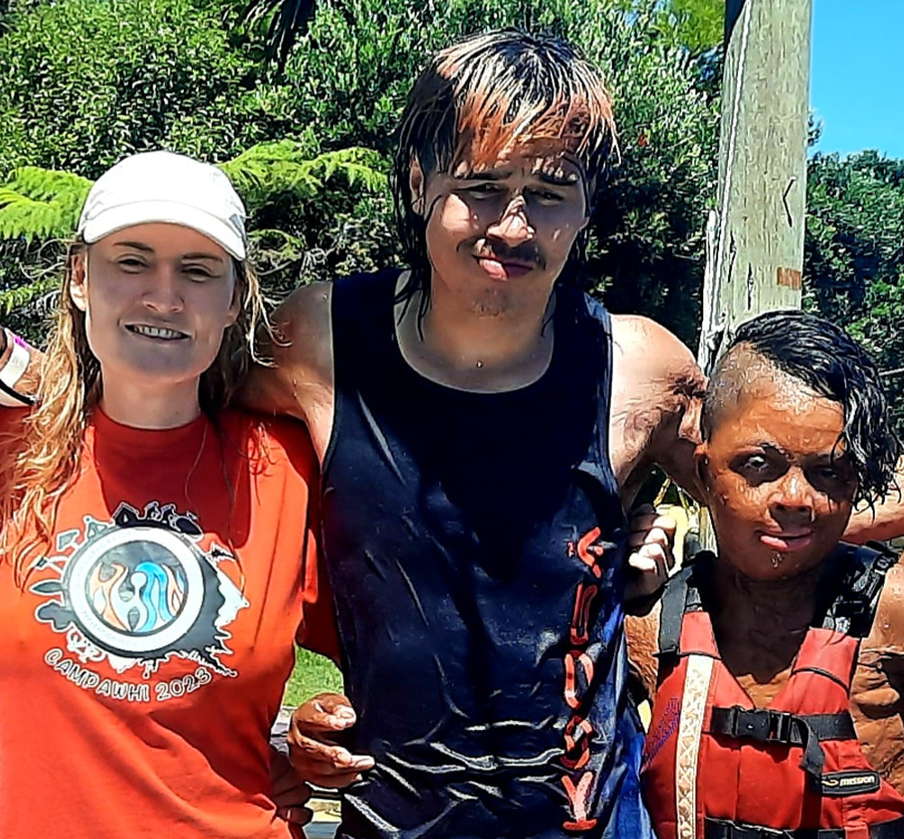 Tayla with two young people at a Burn support group camp
