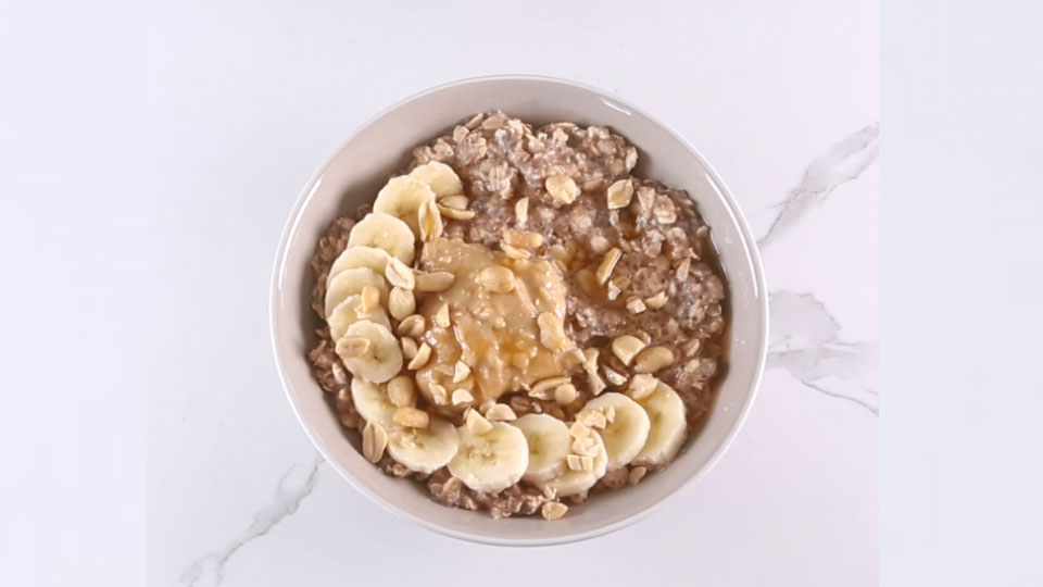 A bowl of oats with banana. 