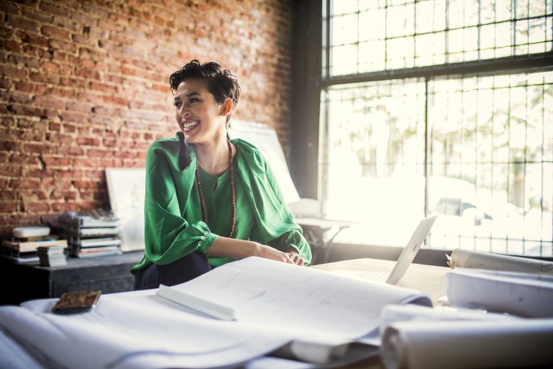 Businesswoman looking over applications in office.