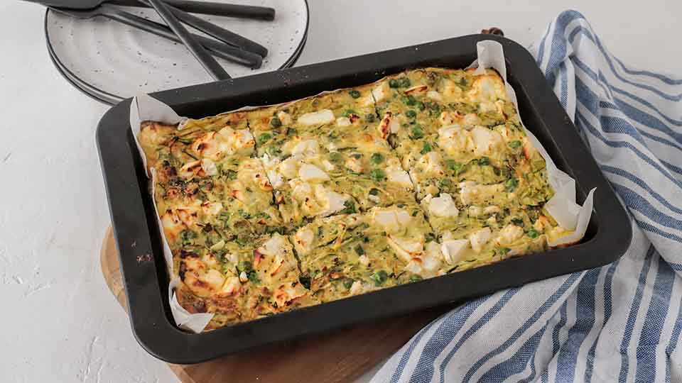 Zucchini and feta slice in a tray.