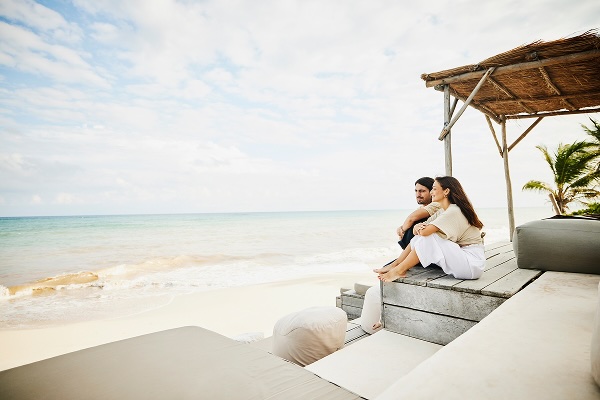 A couple sitting at a beach resort 