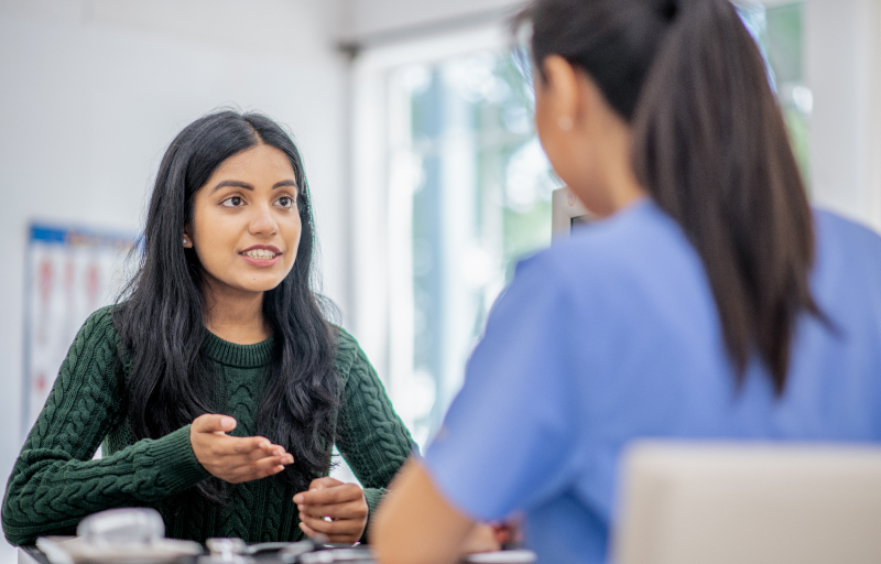 Young female speaking to a doctor