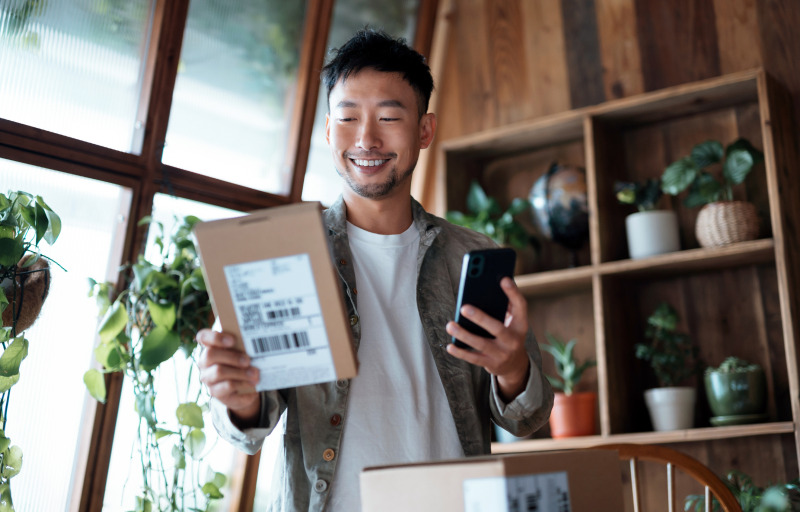 Man smiling at packaged delivered