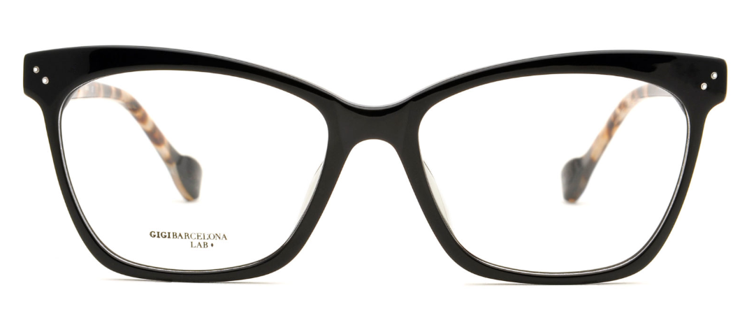 Thick-rimmed black glasses.