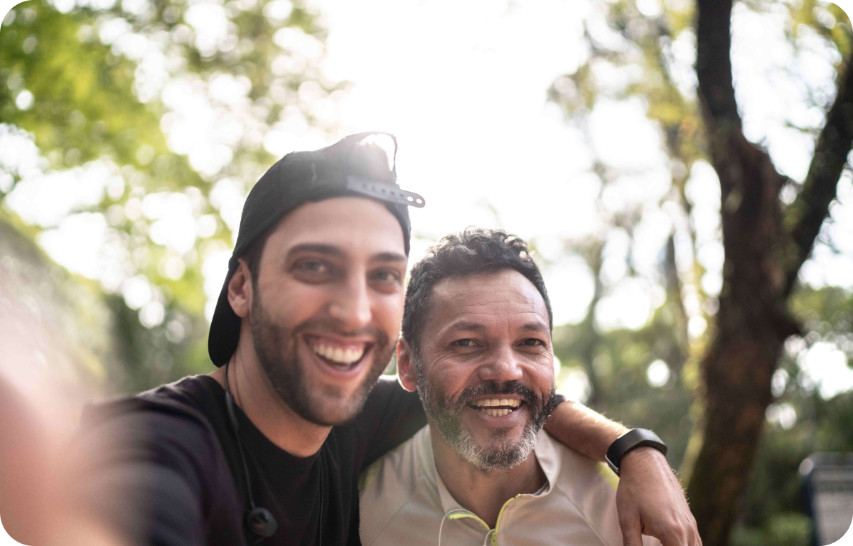 Two men taking a selfie in park