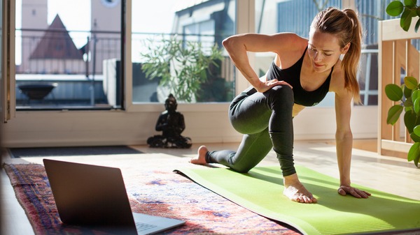 Person stretching on a yoga mat.