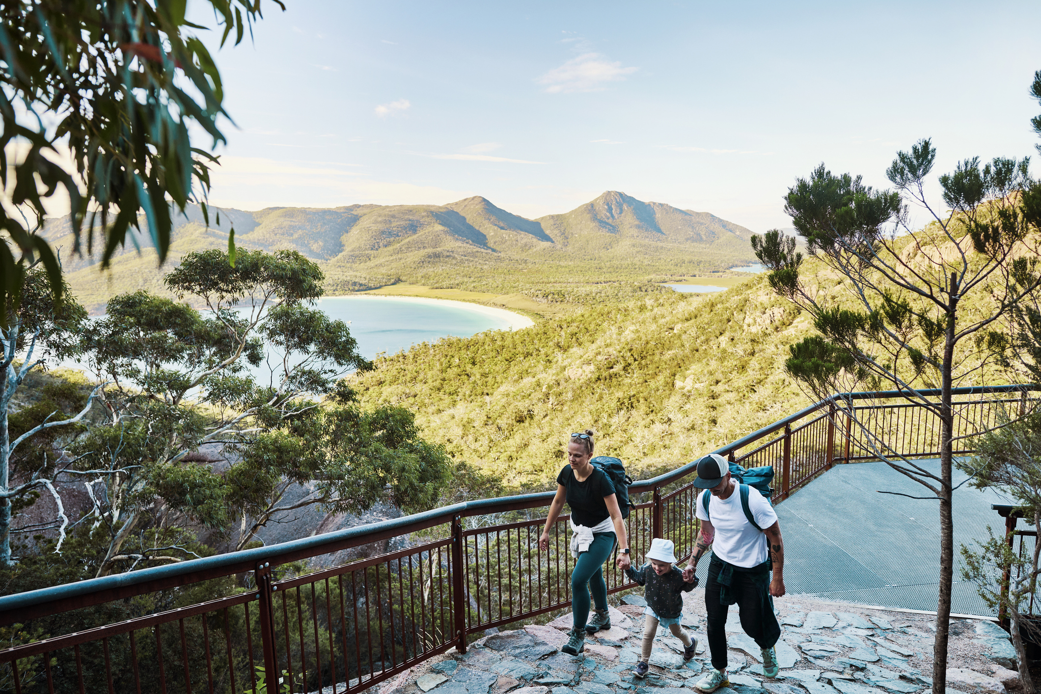 Young active family with a toddler bushwalking outside in the beautiful Freycinet National Park