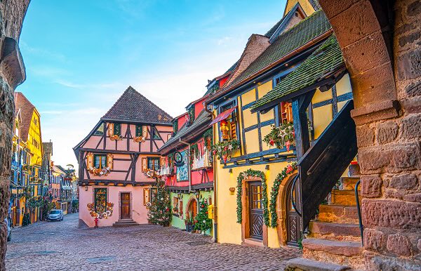 Colourful houses on a cobblestone street in France, Alsace Riquewihr