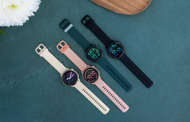 Four smartwatches facing up.