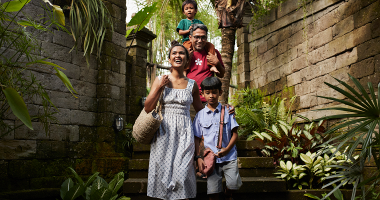 A family walking through a street in Bali