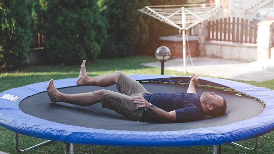 An injured man on a trampoline